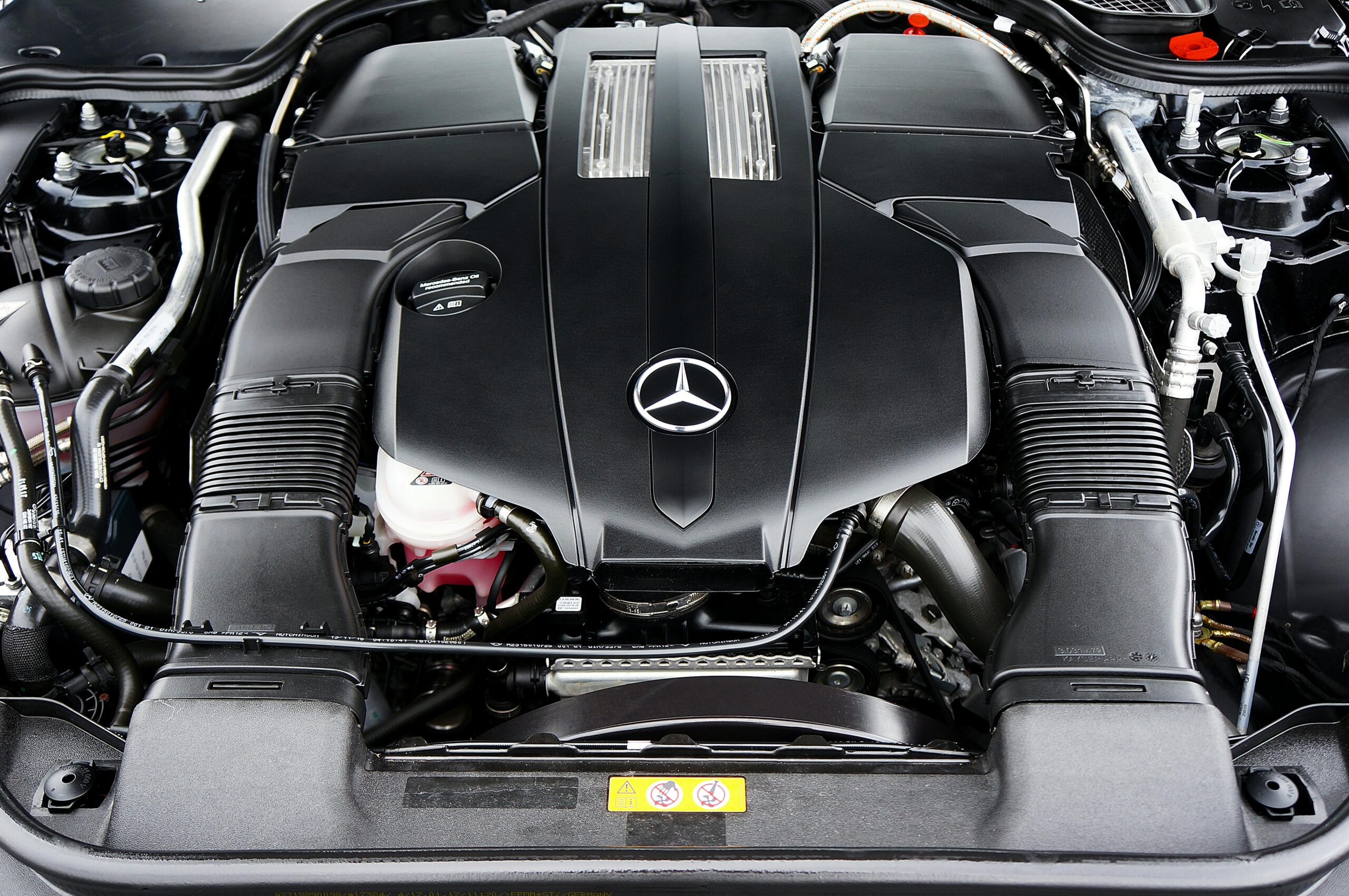 Detailed view of a Mercedes-Benz engine showcasing high-performance automotive design.